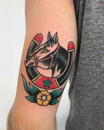 Horse and horseshoe tattoo by Łukasz Krupiński