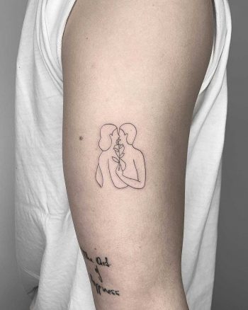 Kissing couple tattoo by Conz Thomas