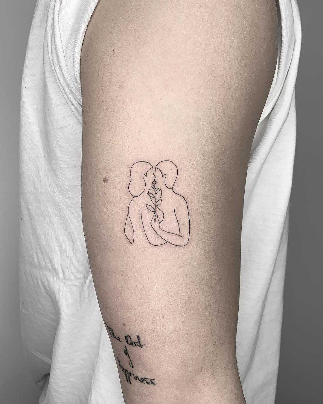 Kissing couple tattoo by Conz Thomas 