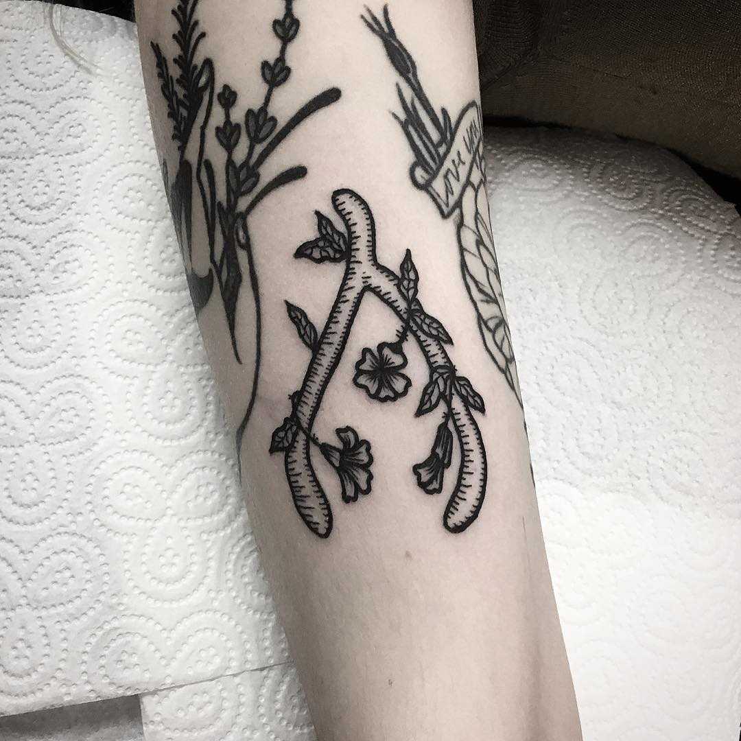 Little wishbone tattoo by Deborah Pow