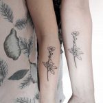 Matching buttercup tattoos by Ann Gilberg