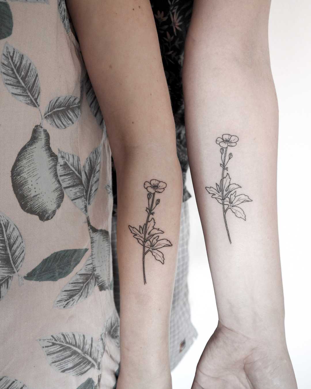 Matching buttercup tattoos by Ann Gilberg