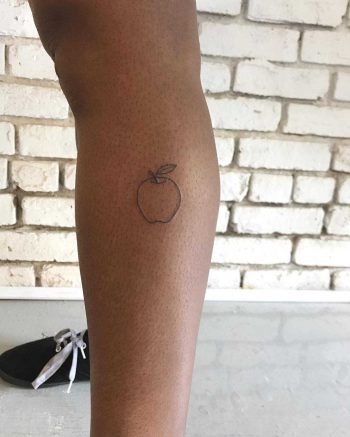 Minimalist apple tattoo by Kelli Kikcio