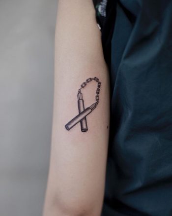 Nunchuks tattoo by Aki Wong
