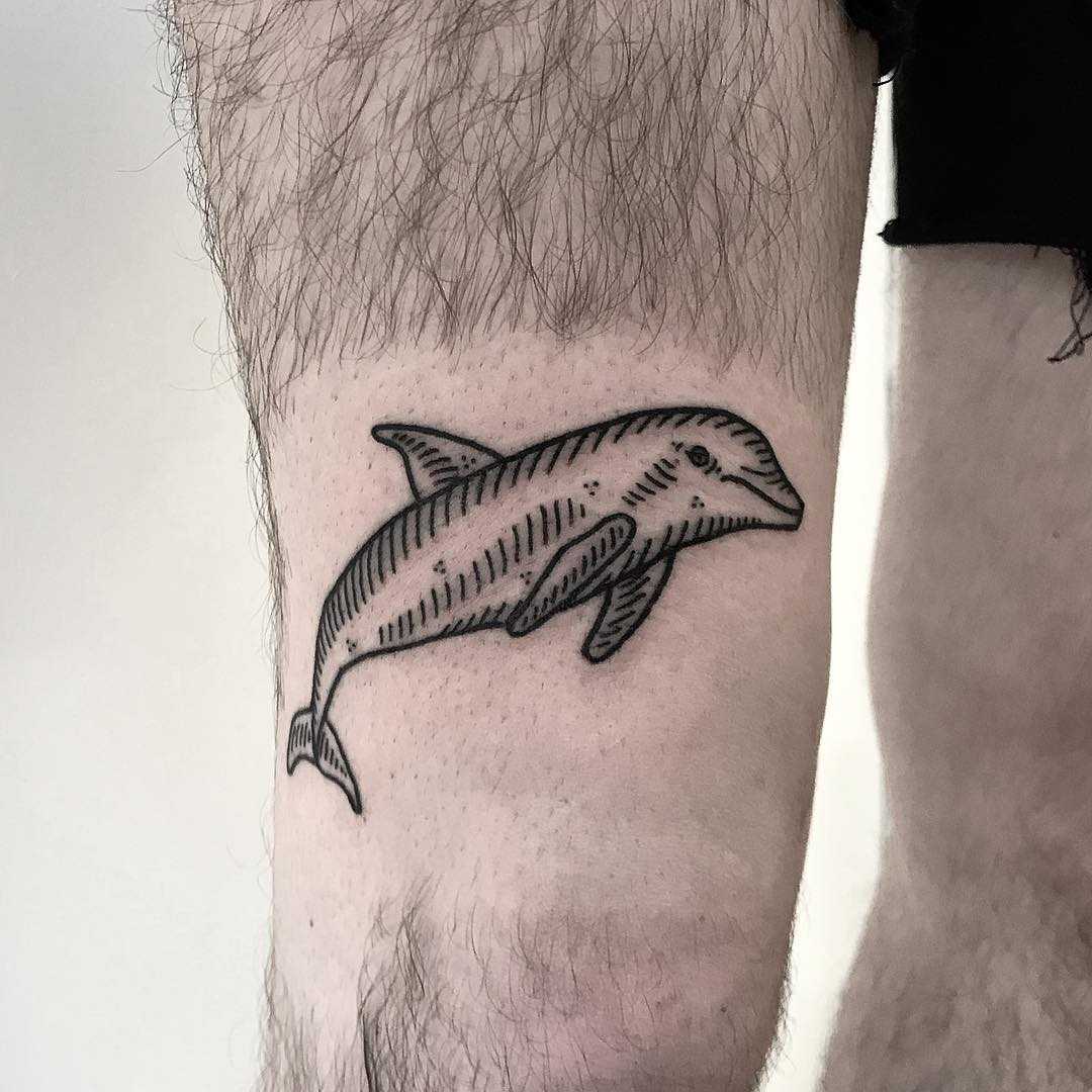 Over the knee jumping dolphin tattoo by Deborah Pow