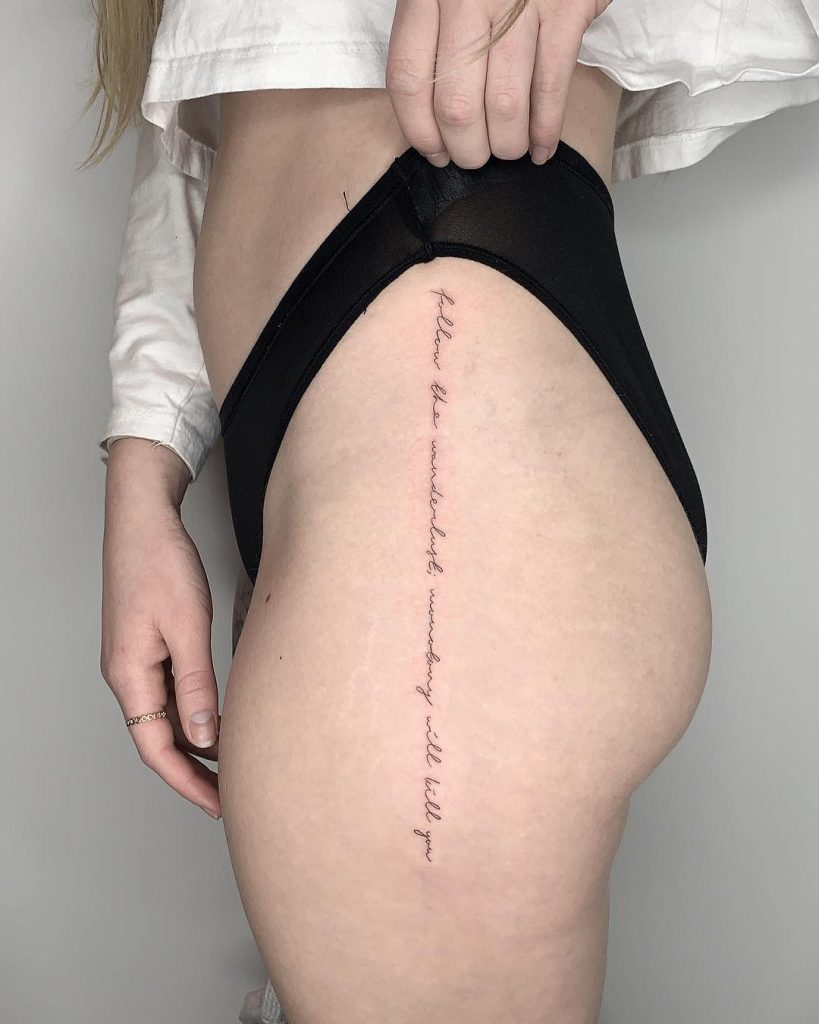 Quote tattoo on a hip by Conz Thomas