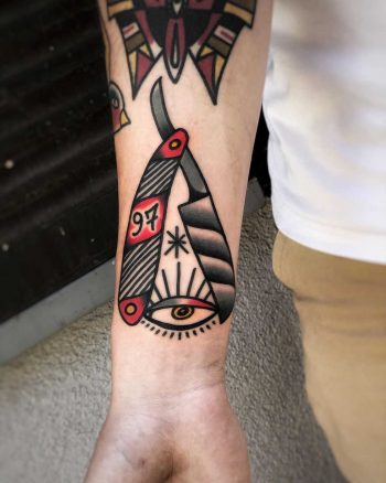 Razor and eye tattoo by Mike Nofuck