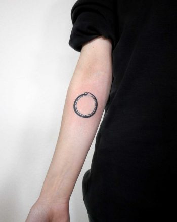 Simple Ouroboros tattoo by Ann Gilberg