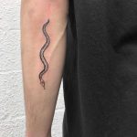 Slippery snake tattoo by artist yeahdope