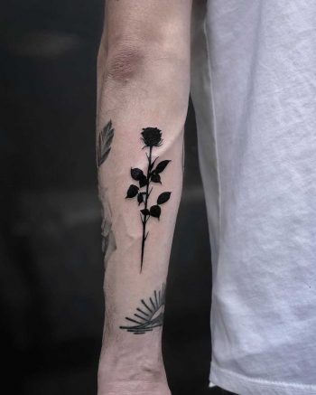 Solid black rose tattoo by Loz McLean