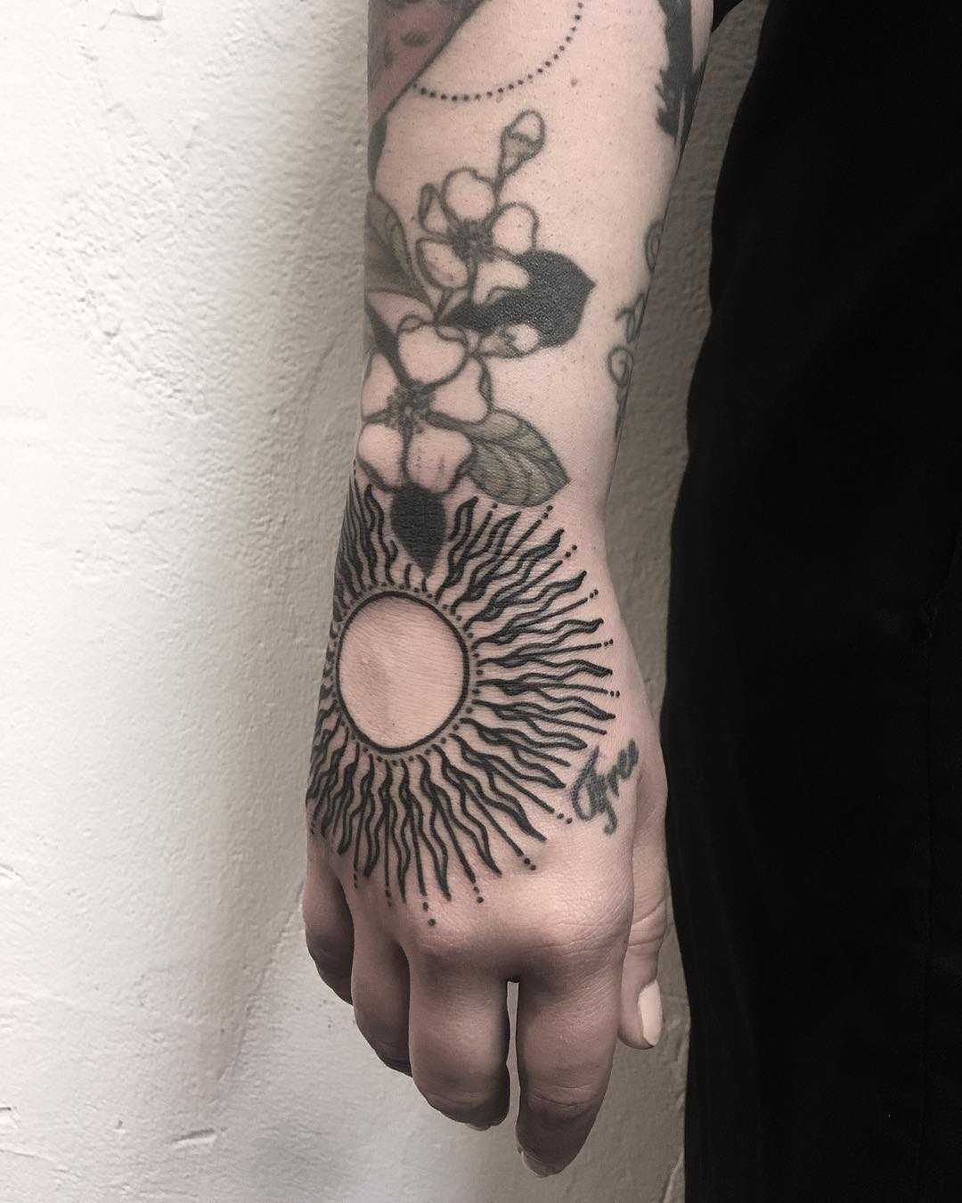 Stylized sun by tattooist Spence @zz tattoo