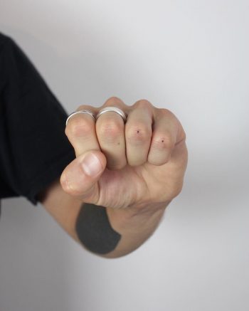 Super tiny knuckle dot tattoos by Lara Maju