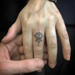 Tiny Lotus on the finger by Kirk Budden