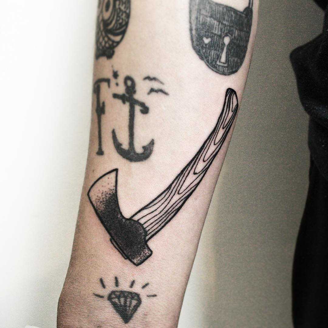Tiny axe tattoo by tattooist Spence @zz tattoo