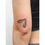 Tiny sycamore seed tattoo by tattooist Zaya