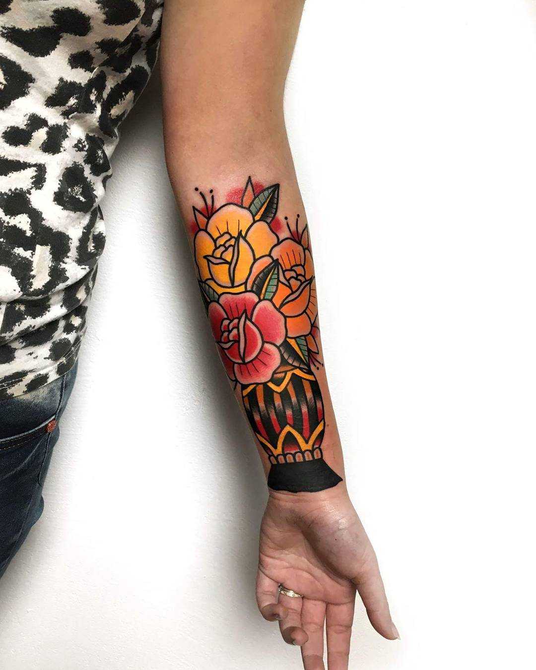 Traditional flower vase tattoo by Mike Nofuck