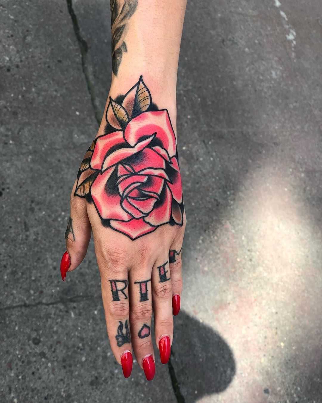 Traditional pink rose tattoo by Mike Nofuck