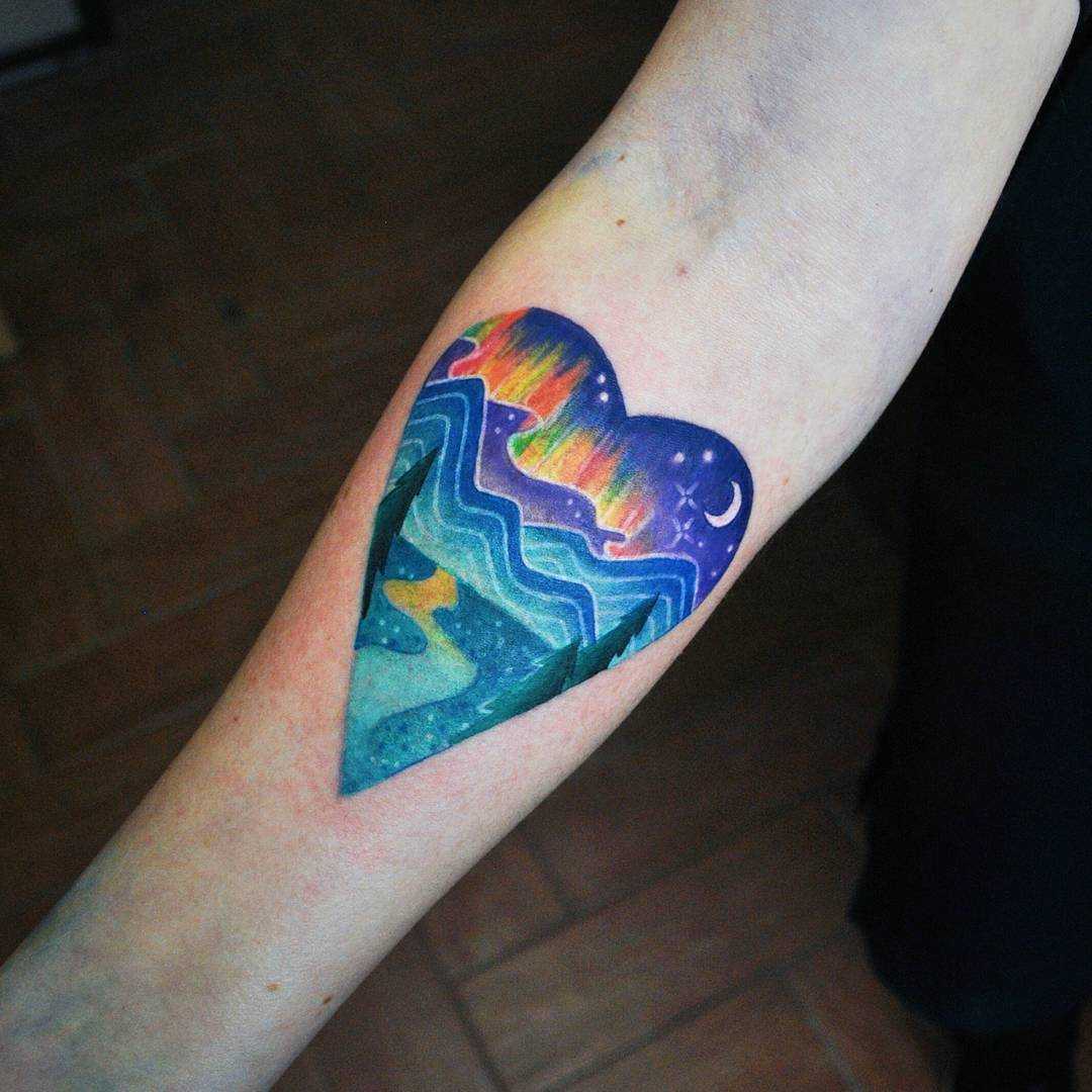Watercolor heart landscape tattoo by Valeria Yarmola