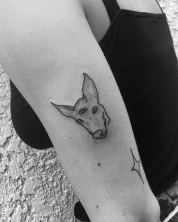 3-eyed greyhound tattoo by Robbie Ra Moore