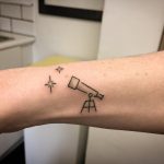 A little telescope and stars tattooed by Kirk Budden