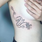 Awesome dragon tattoo by Suki Lune
