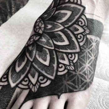 Black and grey foot tattoo by Wagner Basei