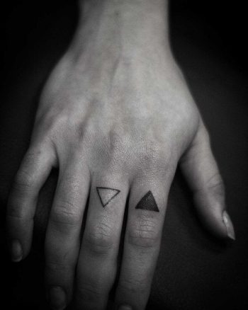 Black and white triangle tattoos by Wagner Basei