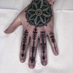Black ornamental tattoos by Tine DeFiore
