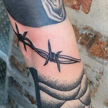 Blackwork barbed wire piece by Tine DeFiore