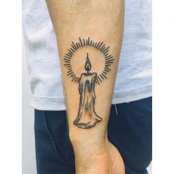 Burning candle by Zaya Hastra