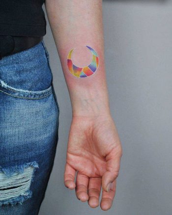 Colorful geometric moon tattoo by Valeria Yarmola