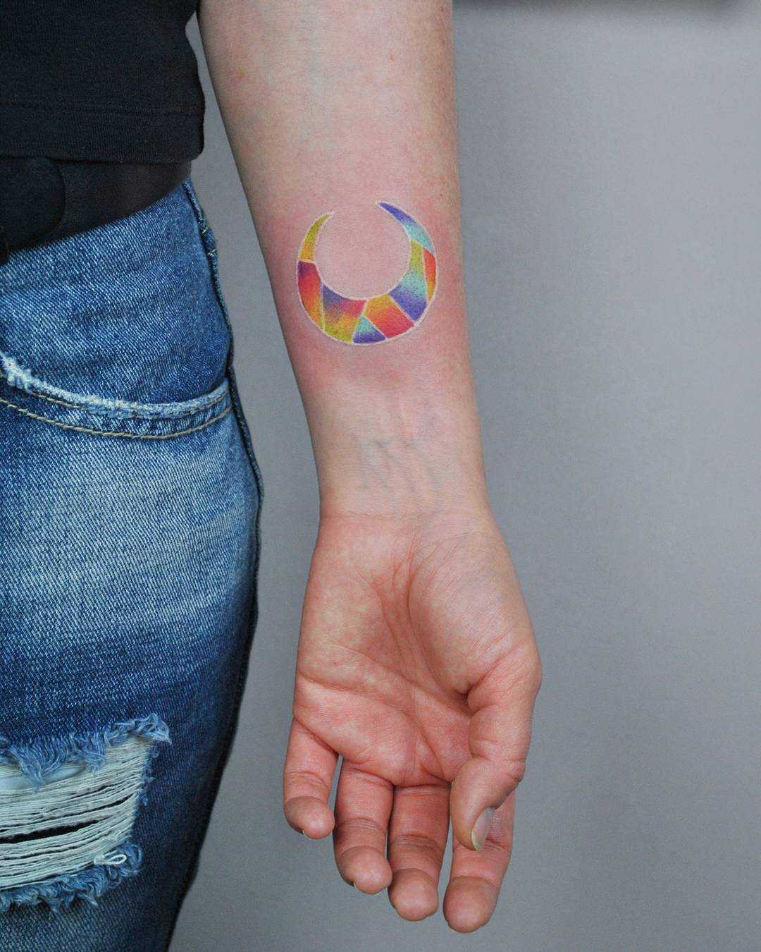 Colorful geometric moon tattoo by Valeria Yarmola 