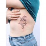 Crocosmia flower tattoo by Zaya Hastra