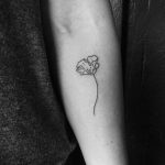 Delicate poppy tattoo by Robbie Ra Moore