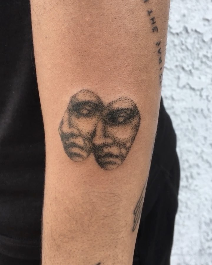 Double dot-work face tattoo by Robbie Ra Moore