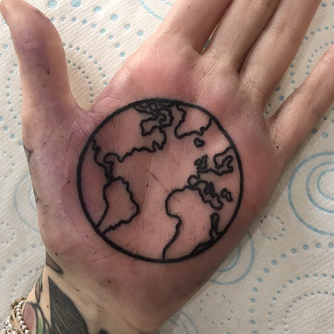Earth tattoo on a palm by Luke.A.Ashley