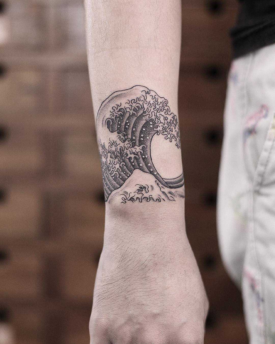 Gorgeous wave tattoo by Aki Wong