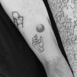 Hand and orb tattoo by Robbie Ra Moore