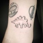 Hand-poked Stegosaurus tattoo by Kirk Budden