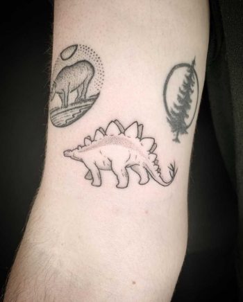 Hand-poked Stegosaurus tattoo by Kirk Budden