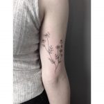 Hand-poked chamomile tattoo by Lara Maju