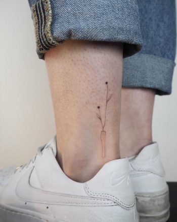 Hand-poked flower vase by Lara Maju