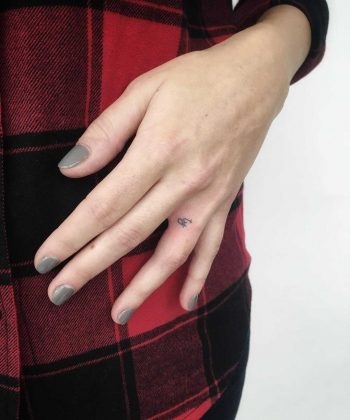 Hand-poked initials by Gianina Caputo