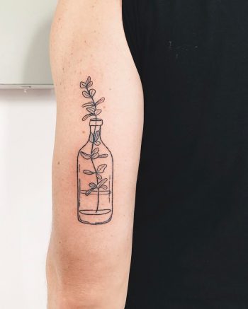 Hand-poked lemon balm tattoo by Kelli Kikcio