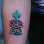 Hand-poked lucky donut tattoo by zzizziboy