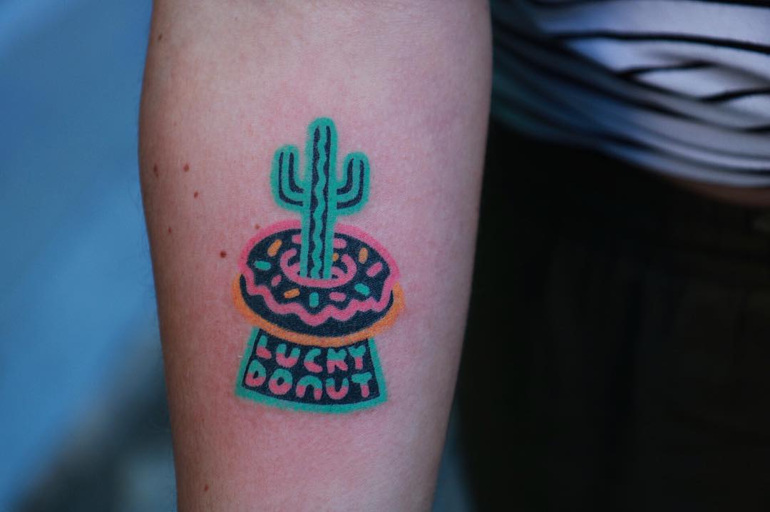 Hand-poked lucky donut tattoo by zzizziboy