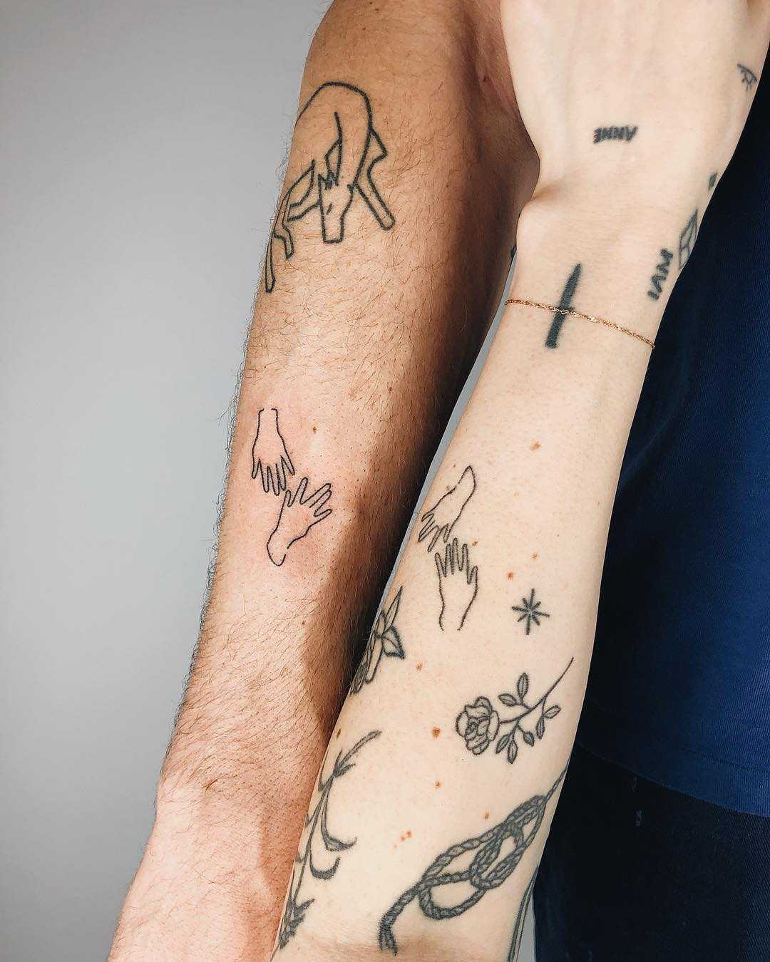 Hand-poked matching couple tattoos by Kelli Kikcio