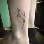 Hand-poked snowdrop tattoo by Kirk Budden