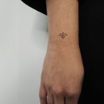 Hand-poked tiny Lotus on a wrist Lara Maju