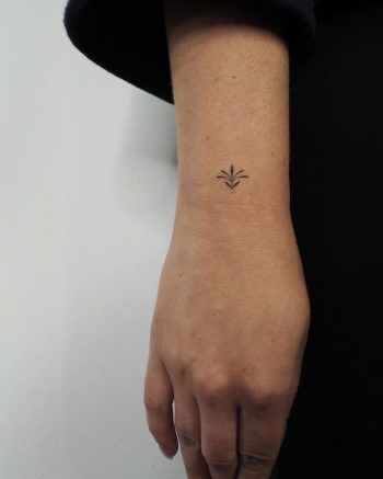 Hand-poked tiny Lotus on a wrist Lara Maju